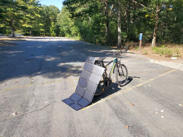 100W panel propped up against bike